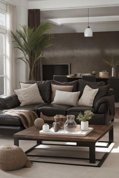 a living room with couches, tables and pillows on the floor in front of a window