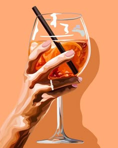 a woman's hand holding a glass of wine with a black straw in it