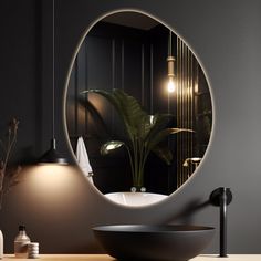 a bathroom with a round mirror on the wall next to a bowl sink and lights