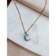 Crafted from 18k gold plating and a luminous turquoise moon pendant, this necklace is sure to become your favorite accessory. Waterproof, stylish and eye-catching, this necklace will add a touch of glamour to any outfit.• Length: 16" + 2" extender chain• 18k Gold plated waterproof necklace chain • Gold plated brass pendant with turquoise stone• Hypoallergenic Trendy Crescent Jewelry Gift, Trendy Turquoise Necklace For Gift, Turquoise Jewelry With Moon Charm For Gift, Turquoise Celestial Jewelry With Moon Charm, Celestial Turquoise Jewelry With Moon Charm, Trendy Moon-shaped Necklace For Gift, Trendy Moon Shaped Necklace For Gift, Trendy Moon Shaped Necklaces For Gifts, Celestial Turquoise Pendant Necklace