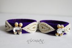 This listing is for 1 PURPLE Color bangle bracelet.   Wrapped with colored wool and lined with white pearls with rhinestone. Colored wool gives that prefect punch of color with simplicity of pearls. The winter bangle accessory could make a great gift to special person and is a must have jewelry in your collection :)  Goes well with any outfit to add that one piece of accessory which will make your outfit complete.    Please note that the colors may vary a little and look a little different on di Purple Beaded Bracelets For Wedding, Purple Bangle For Wedding, Traditional Adjustable Purple Bangle, Adjustable Purple Bangle For Festive Occasions, White Cuff Bangle For Gift, White Cuff Bangle As Gift, White Cuff Bangle Suitable As A Gift, Handmade White Bangle For Parties, Traditional Purple Bangle Bracelets