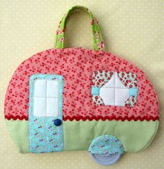 a handbag made out of fabric with an applique on the front