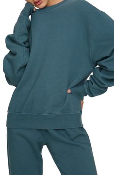 Oversized with a slim fit through the hip, this sweatshirt features extra-long sleeves and cozy fleece for that perfectly lived-in vibe. Crewneck 100% cotton Machine wash, tumble dry Made in USA Women's Clothing Soft-washed Fleece Sweatshirt For Loungewear, Athleisure Cotton Sweatshirt With Raglan Sleeves, Cotton Athleisure Sweatshirt With Raglan Sleeves, Cozy Relaxed Fit Soft-washed Sweats, Comfy Crew Fleece Sweater, Comfy Crew Neck Fleece Sweater, Cozy Soft-washed Crew Sweater, Soft-washed Fleece Sweatshirt For Streetwear, Cozy Washed Relaxed Fit Sweatshirt