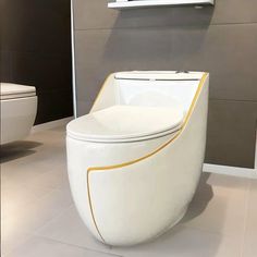 a white toilet sitting on top of a tiled floor