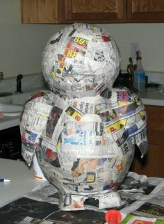 a large paper mache sitting on top of a kitchen counter