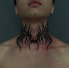 a man with black tattoos on his neck