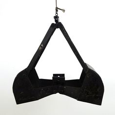 a black bow tie hanging from a hook