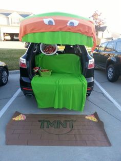 the trunk of an suv is decorated to look like a car with food in it