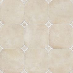 a white tile floor with squares and circles on it's sides, all in different sizes