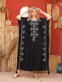 An elegant Moroccan caftan will make you feel like African royalty. It's extremely elegant with a dash of classy cotton embroidery in the front. Ideal for plus size women as well. Made of extremely soft fabric to make you feel free and beautiful at the same time.  This Kaftan is ideal to wear for any casual occasion. Whether taking a trip down the shopping lane, or home-based kitty parties, or about anything else, wearing this dress will make you feel classy and comfortable. Fabric : 70% Egyptia Elegant Cotton Beach Kaftan, Elegant Cotton Kaftan For The Beach, Traditional Black Free Size Kaftan, Oversized Cotton Kaftan, Floral Embroidered Maxi Dress For Beach Cover-up, Elegant Abaya For Vacation, Embroidered Tunic Abaya For Vacation, Vacation Embroidered Tunic Abaya, Elegant Embroidered Kaftan For Vacation