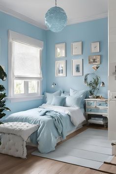 a bedroom with blue walls and pictures on the wall above the bed, along with a white rug