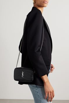 SAINT LAURENT's 'Lou' shoulder bag is easily identifiable by the chevron matelassé leather and polished 'YSL' plaque. Made in Italy, it has a slip pocket at the back and opens to reveal three card slots and enough space inside for your phone, lipstick and keys. The slender chain strap is ideal for wearing across the body or on the shoulder. Ysl Crossbody Belt Bag, Ysl Black Cross Body Bag, Ysl Camera Bag Mini, Sade Mini Tube Bag Ysl, Ysl Mini Nolita Bag, Ysl Bag Solferino, Ysl Bag Mini Lou, Lou Lou Ysl Bag, Ysl Mini Lou Bag Outfit