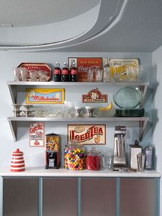 a shelf filled with lots of different types of food and drinks on top of it