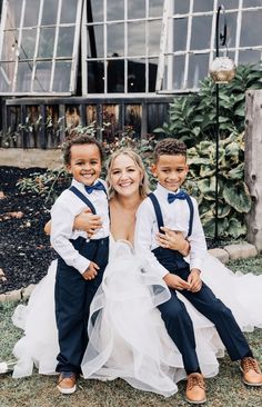 Ring bearers sitting in bride's lap Groomsmen And Ring Bearer Pictures, Wedding Photos Ring Bearer, Bride With Ring Bearer Pictures, Groom With Ring Bearer Pictures, Groom And Ring Bearer Pictures, Wedding Photo Ideas Family Group Shots