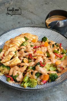 a plate filled with meat and vegetables covered in gravy