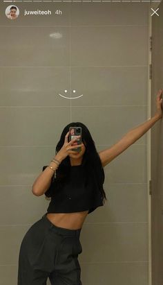 a woman taking a selfie in the bathroom