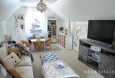 a living room filled with furniture and a flat screen tv