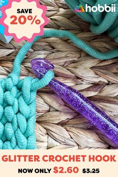 a close up of a purple and blue object on a woven basket next to a book