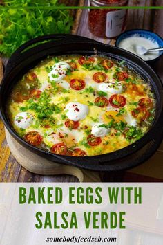 baked eggs with salsa verde in a cast iron skillet on a wooden table