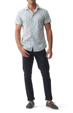 Scattered flowers invite relaxing breezes in a shirt made of soft, breathable cotton and styled to look great tucked or untucked on sunny days. 30" length; 42" chest (size Medium) Front button closure Spread collar Short sleeves 100% cotton Machine wash, line dry Imported Casual Floral Print Shirt With Relaxed Fit, Fitted Cotton Shirt With Floral Print, Spring Collared Shirt For Casual Wear, Casual Fitted Floral Print Shirt, Casual Cotton Shirt With Floral Print, Fitted Shirt For Casual Summer Gatherings, Casual Floral Print Shirt For Spring, Casual Floral Print Spring Shirt, Casual Blue Tops With Ditsy Floral Print