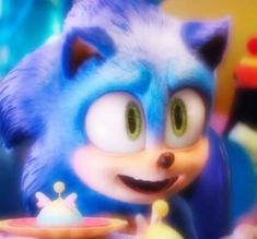 sonic the hedgehog eating food from a plate