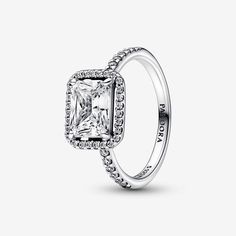 This stunning vintage-inspired ring is one you'll treasure forever. Crafted in sterling silver, this sophisticated Pandora Timeless ring is embellished with a halo of sparkling cubic zirconia stones and features a large rectangular radiant-cut stone as a stand-out centerpiece. Wear it on its own as a statement cocktail ring or style it with contrasting Pandora rings for a fresh, contemporary look. Pandora Rectangular Sparkling Halo Ring - Size 6 | Sterling Silver | 192391C01-52 Pandora Set, Timeless Ring, Bracelet Pandora, Pandora Rings, Promise Rings For Her, Radiant Cut, Multi Stone Ring, Halo Ring, Halo Rings