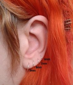 an ear piercing is shown with the measurements