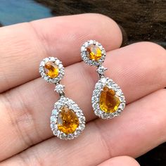 ENJOY OUR WORRY-FREE SERVICE AND THE DAZZLING, GENUINE JEWELRY WE DESIGN AND HANDCRAFT WITH LOVE❤️ ABOUT THE ITEM: CERTIFIED 4.22 Total Carats, Thai yellow sapphires and 1.02 carats of E/VVS, natural diamonds, set in handmade 8.5 grams, 18K solid gold, CHIC dangling earrings. ONE OF A KIND HANDCRAFTED EARRINGS. WE OFFER FREE CHRISTMAS GIFT PACKAGING, CHRISTMAS CARD WITH PERSONAL NOTES, FREE RING SIZING AND FREE-OF-CHARGE 14-DAY RETURN! FREE 2 Days UPS EXPRESS SHIPPING! Grab now before too late I Gia Certified Yellow Gold Teardrop Jewelry, Pear-shaped Diamond Earrings With Gemstones As A Gift, Pear-shaped Diamond Earrings With Gemstone For Gift, Gia Certified Dangle Diamond Earrings As Gift, Hallmarked Pear-shaped Diamond Earrings As Gift, Hallmarked Pear-shaped Diamond Earrings For Gift, Gift Pear-shaped Hallmarked Diamond Earrings, Gia Certified Drop Jewelry For Wedding, Free Christmas Gifts