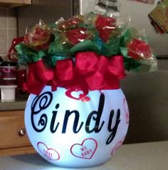 a bowl filled with candy sitting on top of a counter