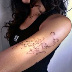 a woman with a tattoo on her arm