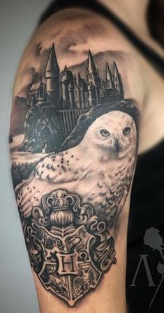 an owl and hogwarts castle tattoo on the arm