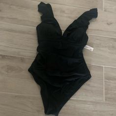 New With Tag !! Cupshe Ruffled One Piece Swimsuit. Size S. Black. V Neck . Lace Up Back . Removable Bra Pads Included . 80% Nylon /20% Spandex. Perfect Condition - Never Worn!! No Trades Solid Ruffled Bodysuit For Poolside, Solid Color Ruffled Bodysuit For Poolside, Ruffled Bodysuit For Poolside, Black Summer Bodysuit With Ruffles, Black Ruffled Summer Bodysuit, Black Ruffled Bodysuit For Beachwear, Bra Pads, Neck Lace, Padded Bras