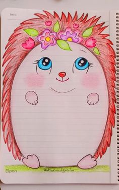 a drawing of a hedgehog with flowers in her hair on top of a notebook