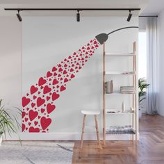 a wall mural with hearts on it and a lamp in the corner next to it