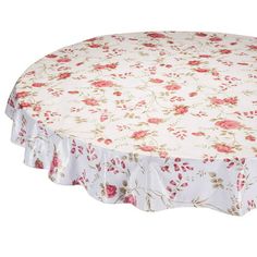 a round tablecloth with pink flowers on it