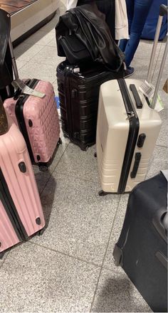 several pieces of luggage sitting on the ground