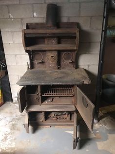 an old fashioned wood stove in a garage