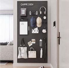 there is a black pegboard with many items on it