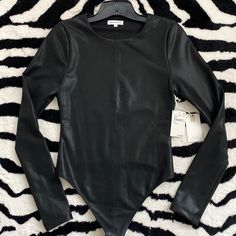 Purchased On The Good American Website And Never Worn! Soft Lightweight Faux Leather! Good American, Color: Black, Size: 1= Small Gb0349 Self Front: 100% Polyurethane Self Back: 92% Polyester, 8% Elastane Lining: 95% Polyester, 5% Elastane Crew Neckline Faux Leather Fabric Long Sleeve E Thanks For Looking! Sleek Fall Bodysuit For Night Out, Sleek Bodysuit For Night Out In Fall, Sleek Black Bodysuit For Fall, Cut Out Hoodie, Deep V Bodysuit, Leather Bodysuit, Womens Sherpa, Racerback Top, Faux Leather Fabric