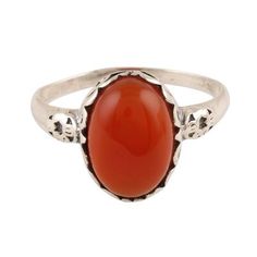 Glamorously beautiful this cocktail ring from India is presented by Alok Jain. Local artisans craft the ring of sterling silver caressing a large oval of red-orange carnelian with swirling vine motifs. Luxury Carnelian Oval Cabochon Rings, Oval Carnelian Orange Ring, Oval Orange Carnelian Rings, Orange Oval Carnelian Rings, Carnelian Oval Cabochon Ring As Gift, Carnelian Oval Cabochon Ring For Gift, Oval Carnelian Ring For Gift, Oval Carnelian Wedding Rings, Handmade Oval Carnelian Ring