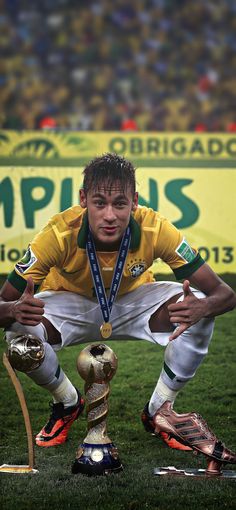 an image of a soccer player holding the world cup