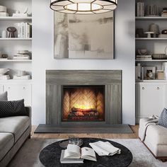 a living room filled with furniture and a fire place in the middle of the room