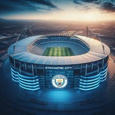 an aerial view of the manchester city football stadium at night with bright lights on it