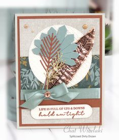 a close up of a card with leaves on it