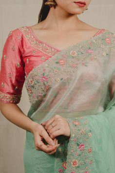 Mint green organza saree with floral and pearl embroidered scalloped borders. Comes with a raw silk blouse embellished with zari and pearl threadwork.
Component: 2
Pattern: Embroidered
Type Of Work: Pearl, Threadwork, Zari, Zardozi
Neckline: Sweetheart
Sleeve Type: Half
Fabric: Saree: Organza, Blouse: Raw Silk
Color: Green,Pink
Other Details: 
Weight: 1-2 kgs
Attached lining
Embroidered border
Occasion: Reception,Sangeet - Aza Fashions Embroidered Organza Blouse For Wedding, Green Chanderi Blouse With Sheer Dupatta, Fitted Green Organza Saree, Green Organza Blouse Piece With Zari Work, Green Organza Blouse With Resham Embroidery, Pista Green Cotton Silk Blouse Piece For Wedding, Wedding Blouse Piece In Pista Green Cotton Silk, Pista Green Chanderi Blouse For Wedding, Green Organza Blouse Piece For Reception