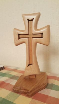 a wooden cross sitting on top of a table