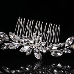 Bridal rhinestone gem crystal flower wire wedding theme decorative hair comb. Lightweight and elegant, his beautiful wedding theme hair comb goes well with any special occasion hair style. Wear it with a high or low hair bun and adjust the crystal branches according to your vision. The decorative bridal hair comb is perfect for weddings, dance events, proms or cosplay hair stylesDIMENSIONS: 7.75" L x 2.0" WMATERIALS: Metal wire, rhinestone crystals Low Hair Bun, Flower Hairpiece, Special Occasion Hair, Flower Wire, Pearl Bridesmaid Jewelry, Brides Hair, Occasion Hair, Decorative Hair Combs, Beach Jewelry Boho