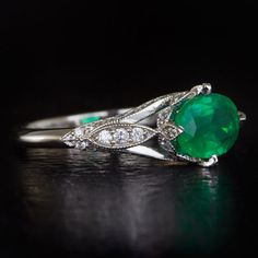 Featured here is a stunning vintage inspired emerald and diamond ring with timeless style and class! Prong set in the center of this ring is a slightly larger than 1 carat natural emerald with lovely saturation! The natural earth-mined emerald adds a wonderful pop of color to this ring. The rich emerald is complemented by 54 fully faceted round cut diamonds which are all white and clean to the naked eye. The small diamonds have great sparkle as well and look even better in person. The ring is ma Vintage Inspired Rings, Emerald And Diamond Ring, Vintage Cocktail Ring, Ring Art Deco, Vintage Cocktail, Vintage Inspired Design, Natural Earth, Natural Emerald, Emerald Ring