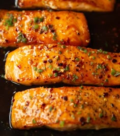 some food is cooking in a pan on top of the stove and ready to be cooked