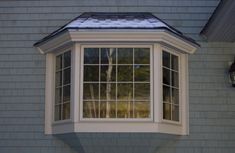 an open window on the side of a house